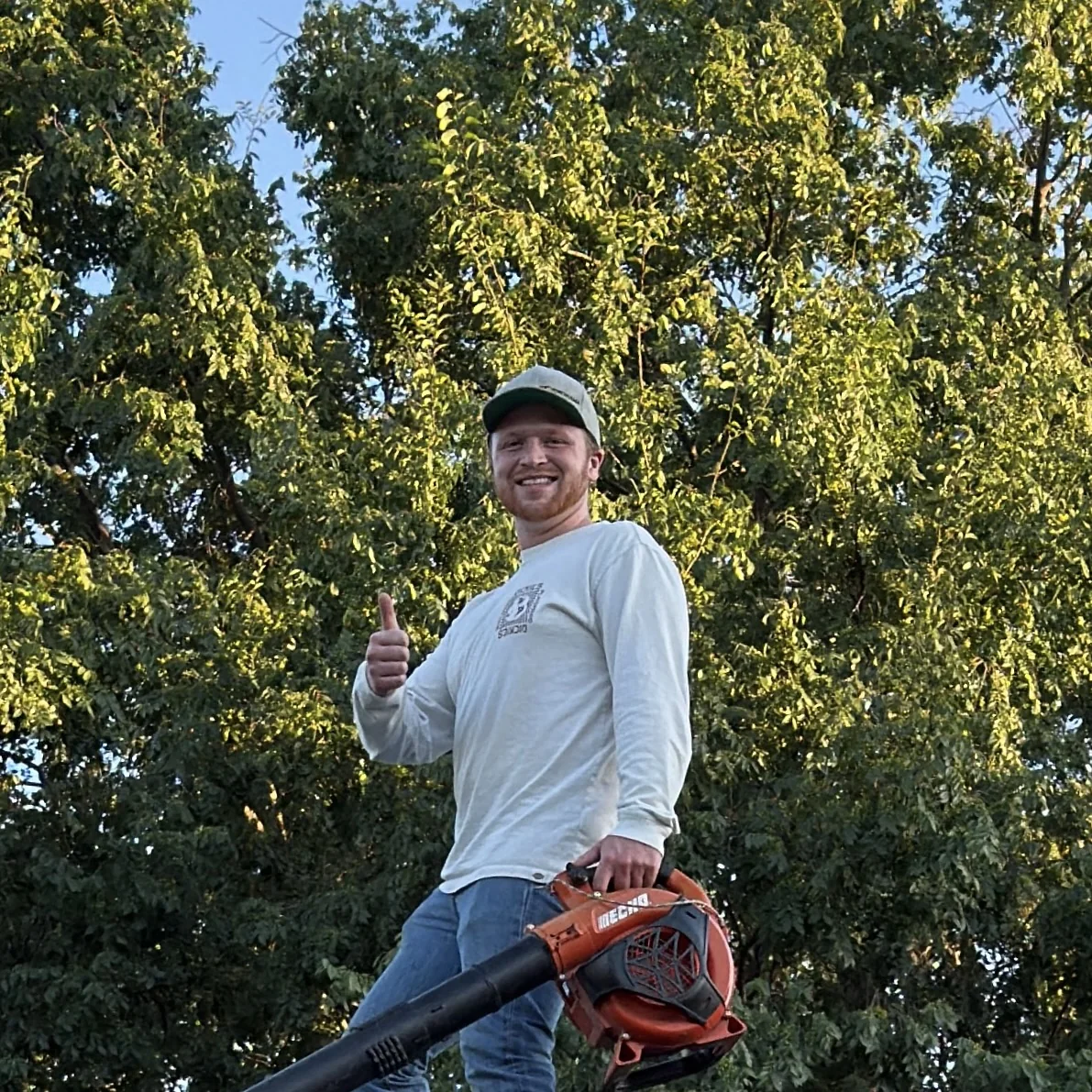 Joshua, founder of Spring River Exteriors, giving a thumbs up on the job